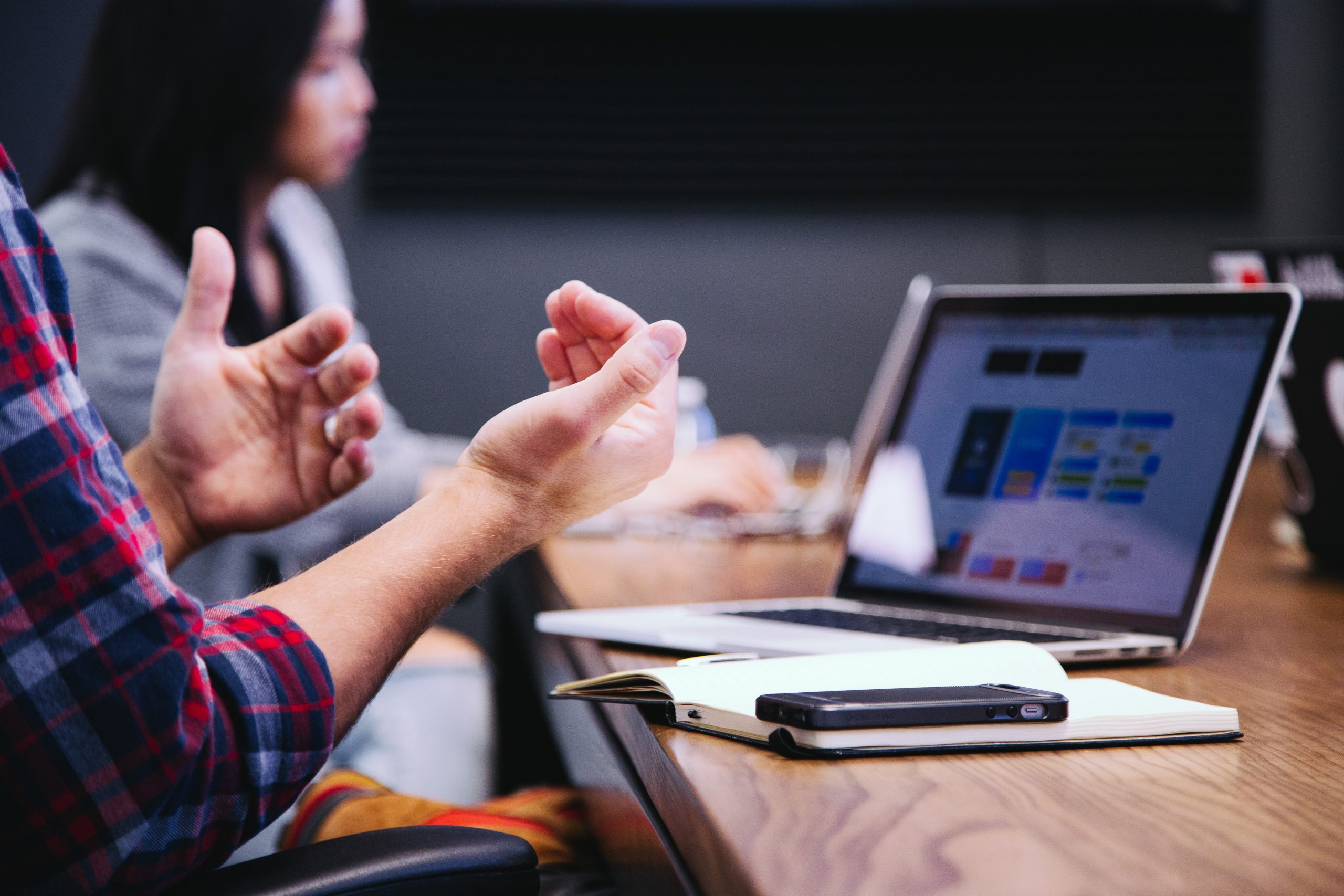 hand gestures in front of a laptop during meeting